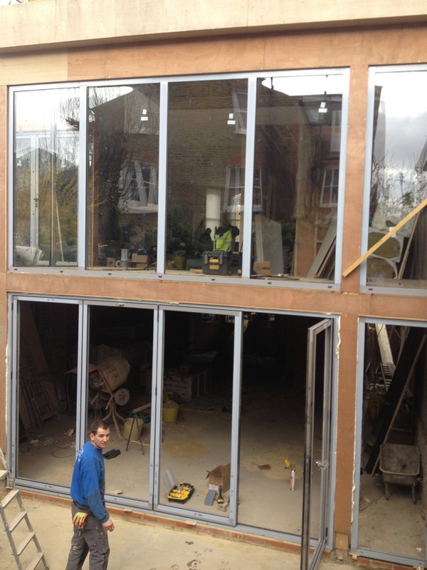 Aluminium bi-fold doors with two-storey glazing in Greenford