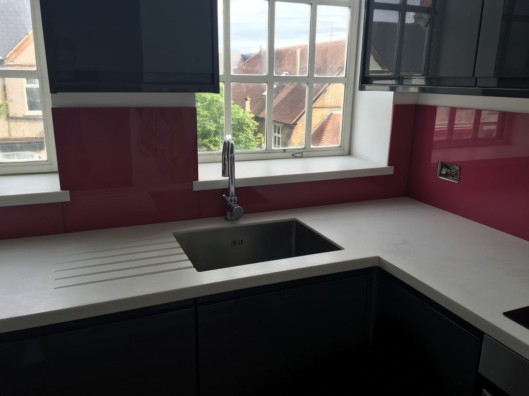 Deep plum coloured glass splashback in modern Greenford kitchen
