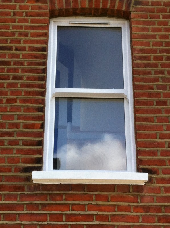 uPVC sash window on Victorian red brick house in Greenford